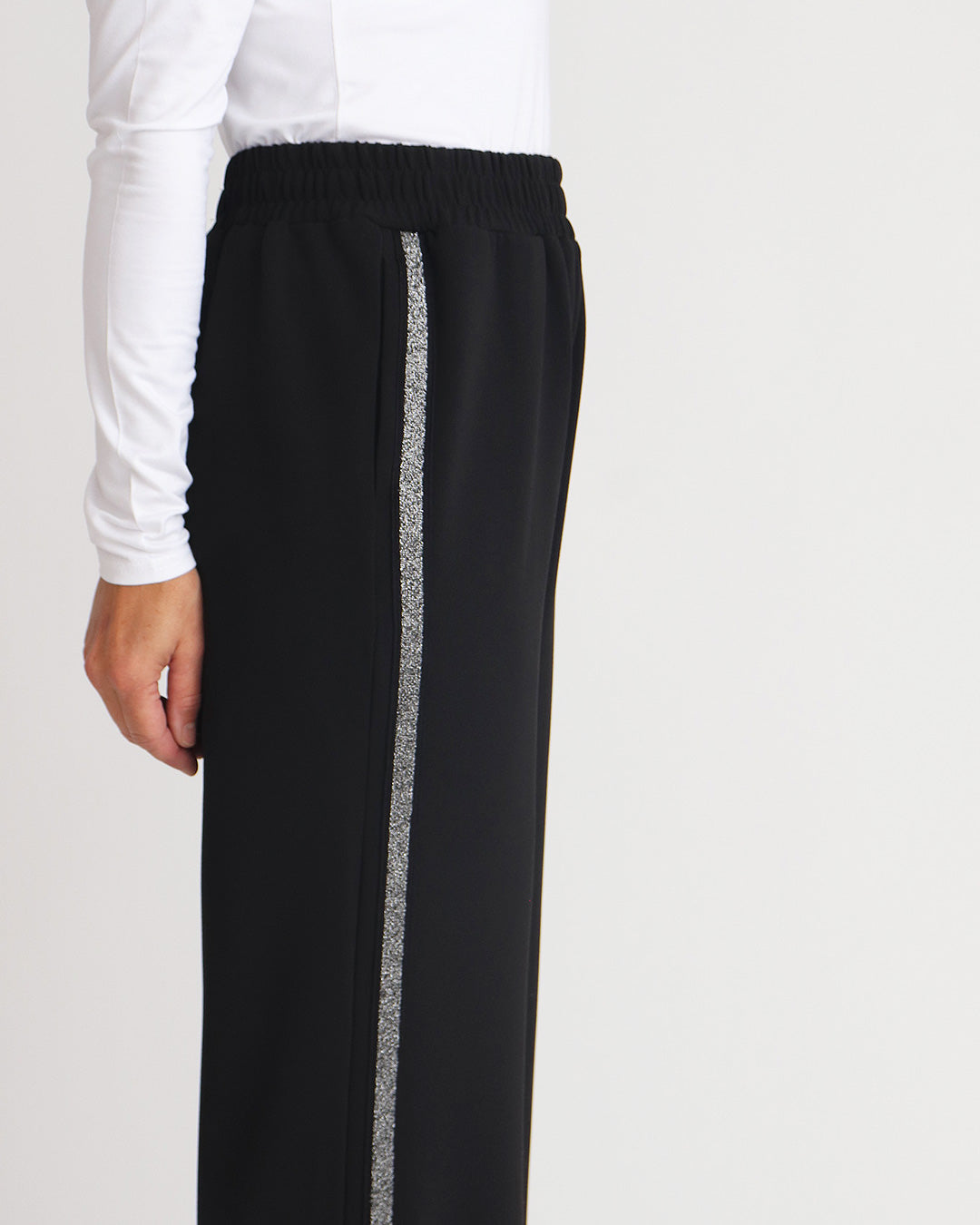 Black pants with silver stripe on sale